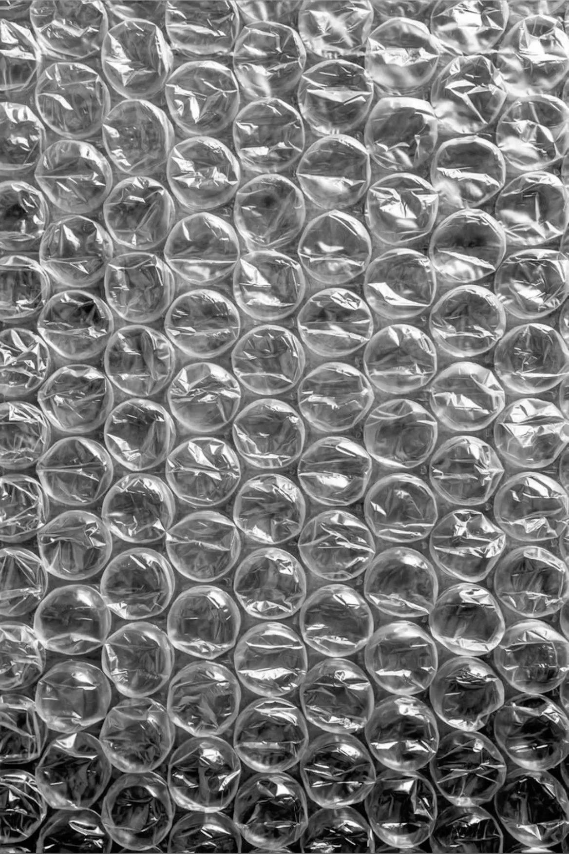 Original photo — Bubble wrap pattern vector line drawing, grid of circular domes with radial crease lines and interlocking flat seams.